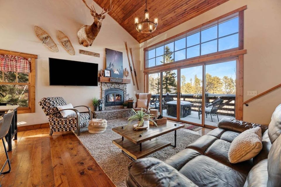 Main level living space with woodburning fireplace