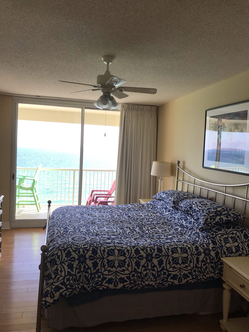 King master bedrom looking out onto beach balcony