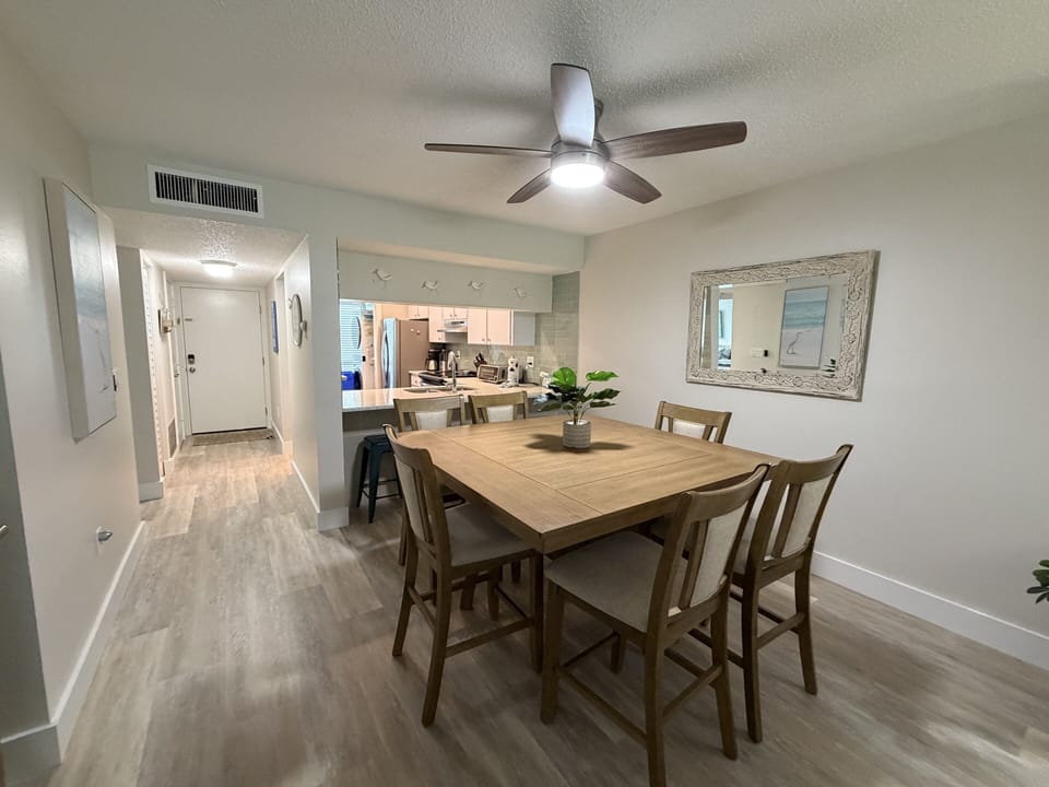 Gather around this welcoming dining table where your group can share meals and stories in comfort.