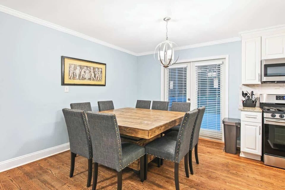 Dining area adjacent to french doors--opens directly to the spacious deck & yard area