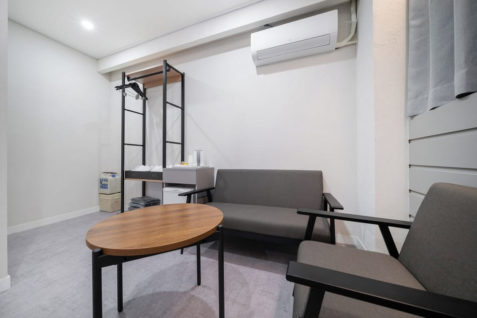 Family Room, 2 Queen Beds, Non-Smoking, City View, No Parking, Check-in after 6 PM | Down comforters, memory foam beds, desk, laptop workspace