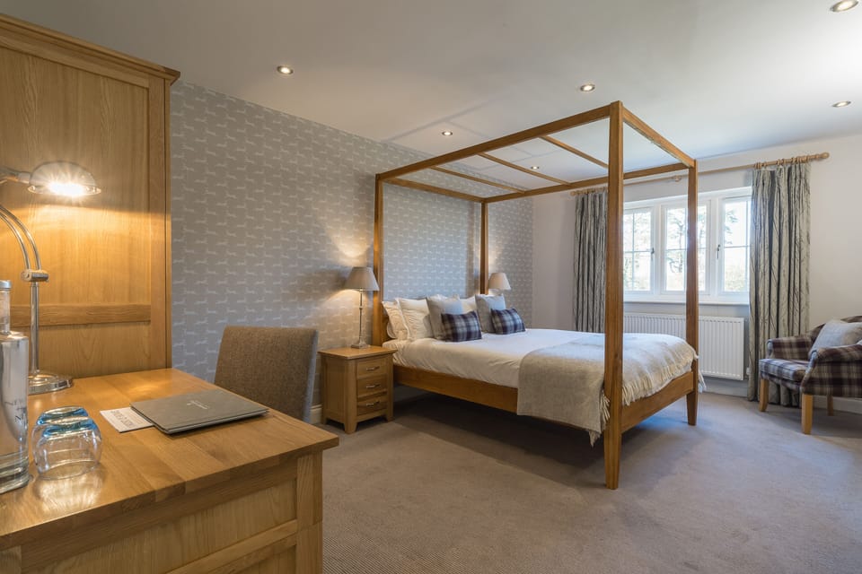 Desk, iron/ironing board, bed sheets