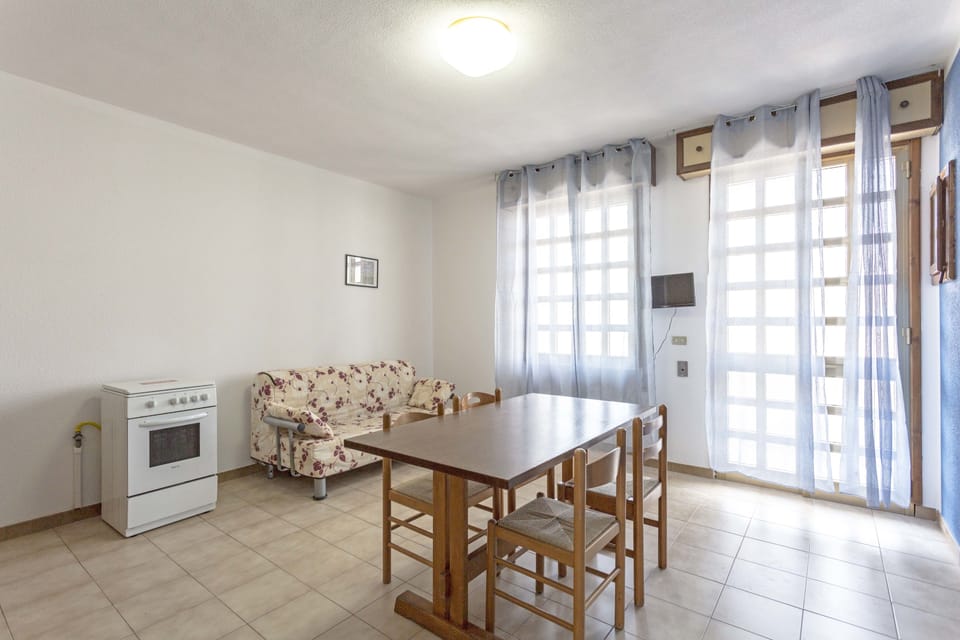 Apartment, 1 Bedroom (Piano Rialzato) | Private kitchen | Fridge, oven, stovetop, cookware/dishes/utensils