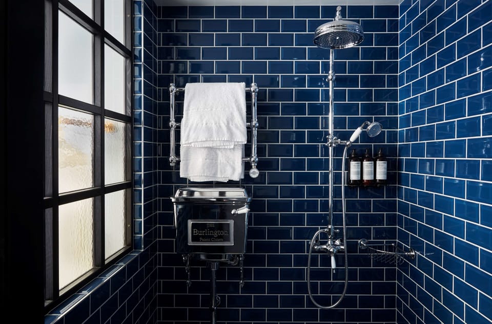 Shower, rainfall showerhead, designer toiletries, hair dryer