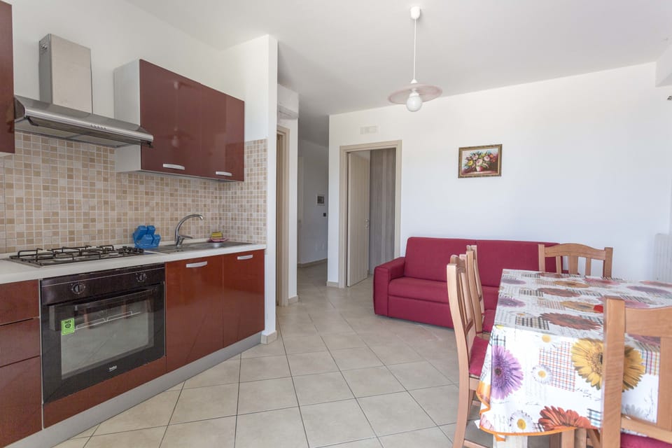Apartment, 1 Bedroom | Private kitchen | Full-size fridge, oven, stovetop, cookware/dishes/utensils