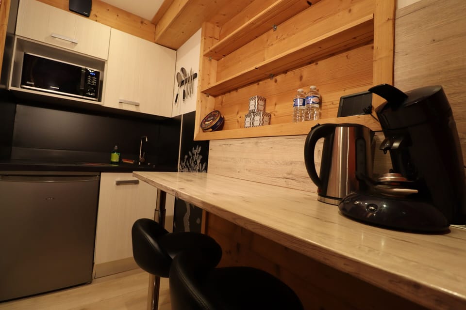 Fridge, microwave, cleaning supplies