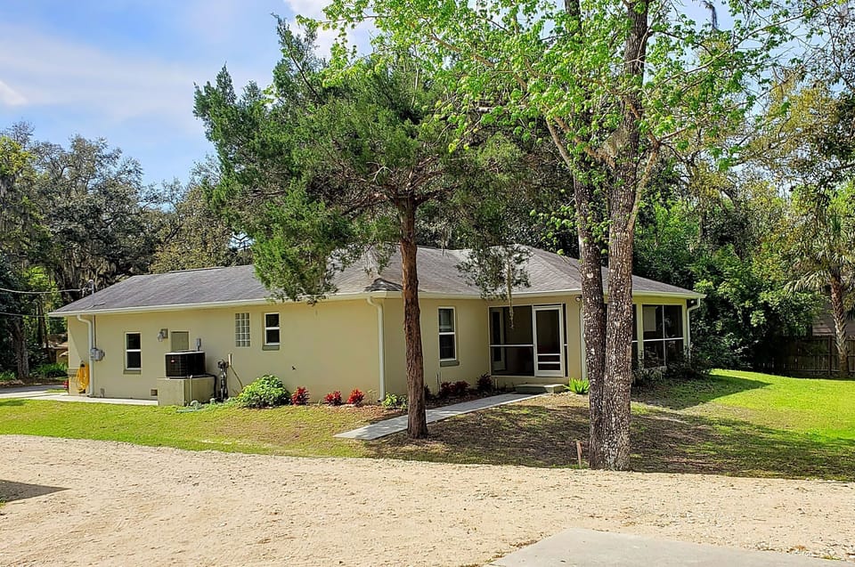 House from the side and the rear screened patio
