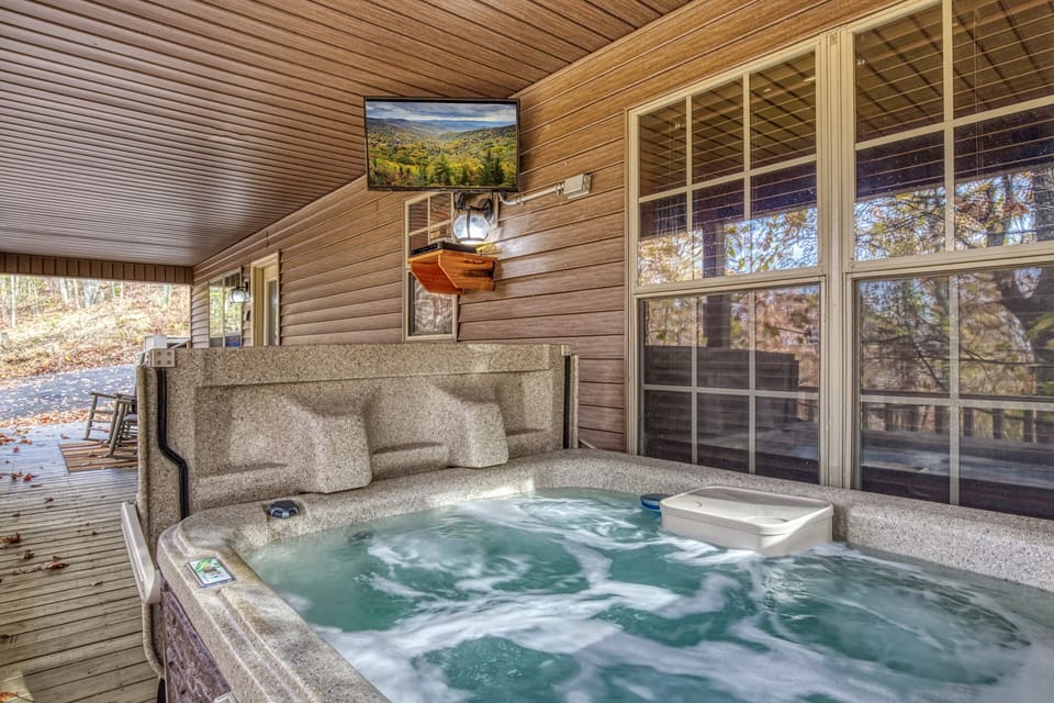 Pet Friendly Cabin in Gatlinburg "The Road Less Traveled" - Covered deck with hot tub and TV