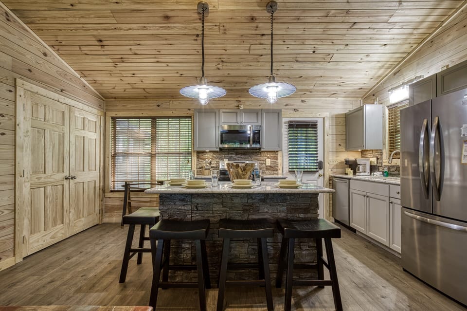 Smoky Mountain Cabin - Little Piece of Heaven - Kitchen island and fully furnished kitchen with stainless steel appliances