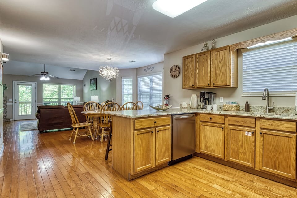 Cabin on the River in Pigeon Forge "Silver Springs" - Fully furnished kitchen, dining area, and living room