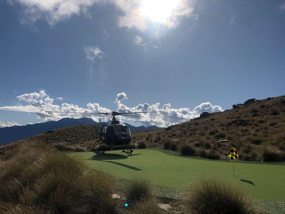 Helicopter from Over The Top Golf on Cecil Peak green 
