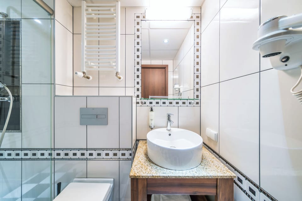 Comfort Double Room, 1 Queen Bed, City View, Tower | Bathroom | Shower, hair dryer, towels, soap