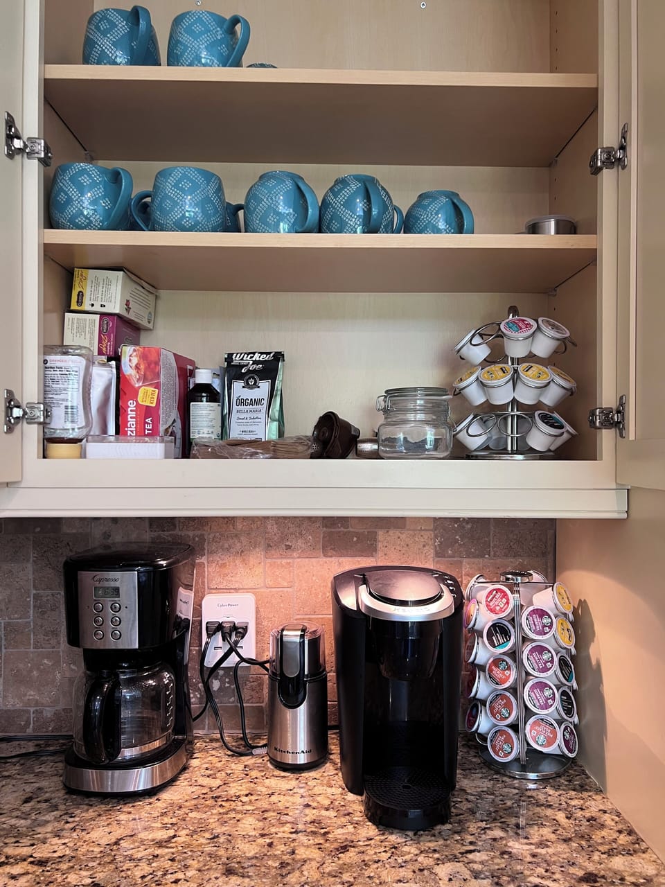 Coffee bar with a traditional coffee pot, a Keurig with pods & and bean grinder.