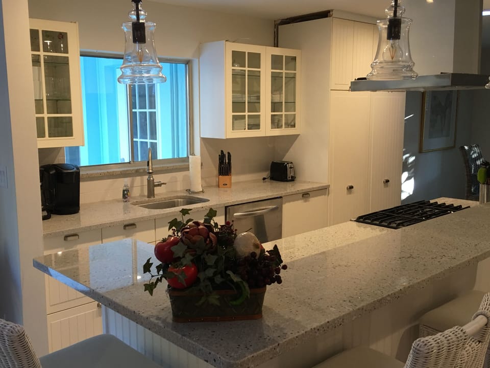 Kitchen highlighting cabinetry and granite counters