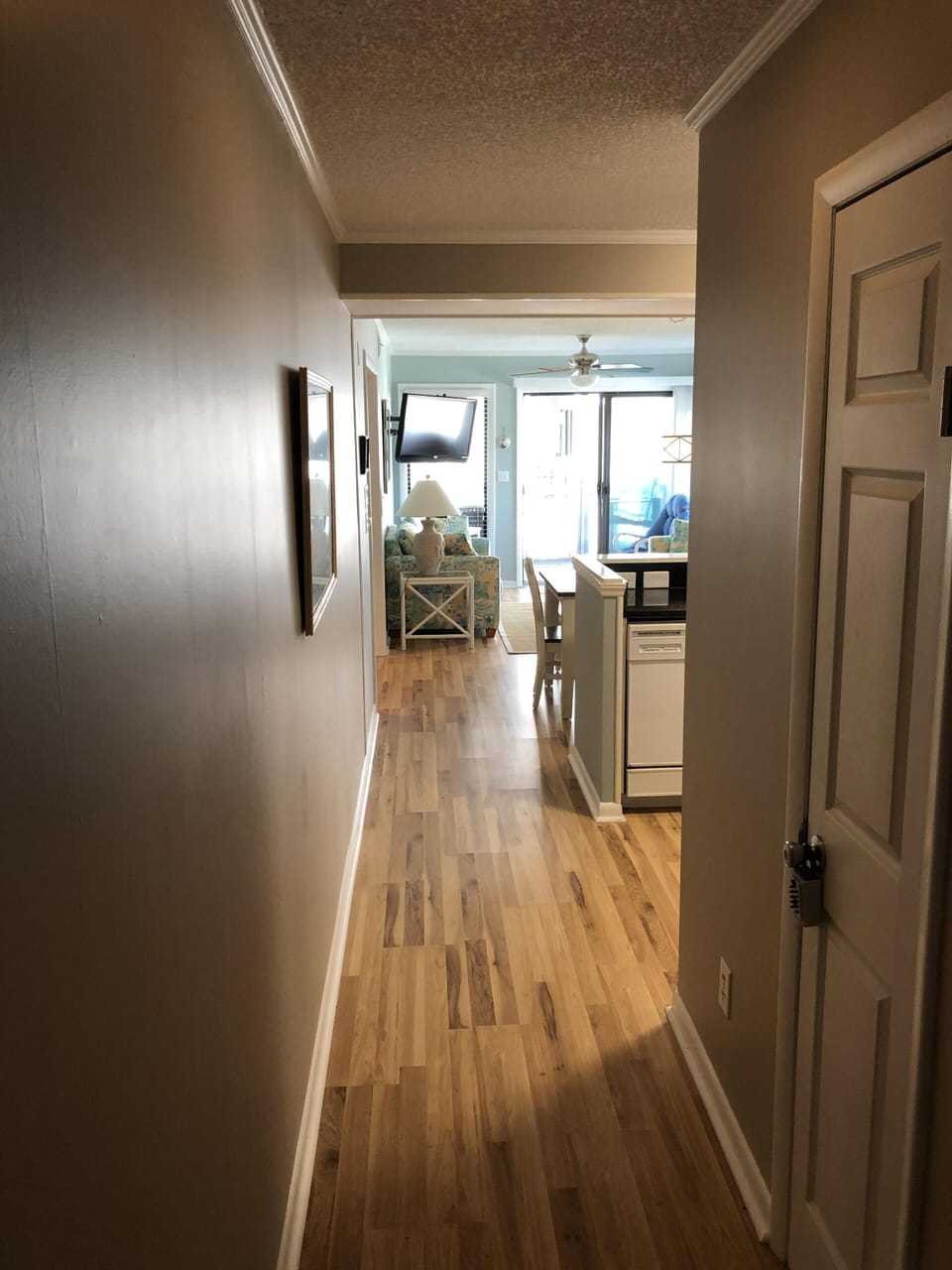 Entrance hallway. New solid surface flooring. 
