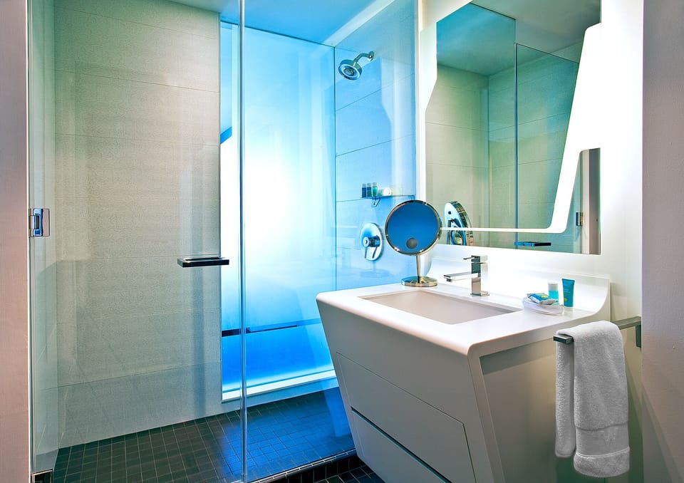 Shower, rainfall showerhead, designer toiletries, hair dryer