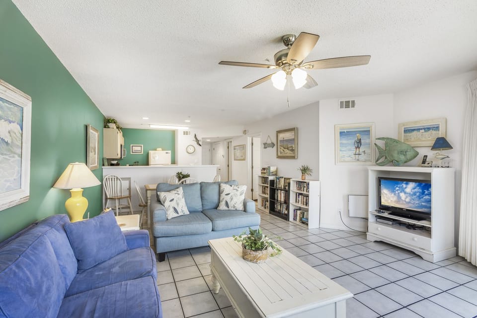 Sink into the sofa in this cheerful, open living space.