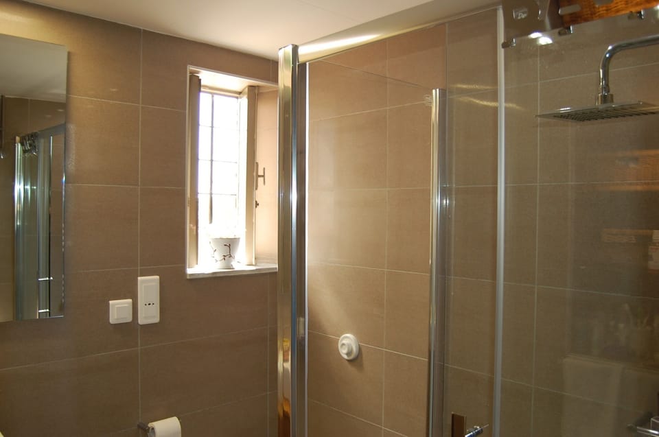 Bathroom 1 - all 3 bathrooms are modern, granite tiled, with rain showers, 