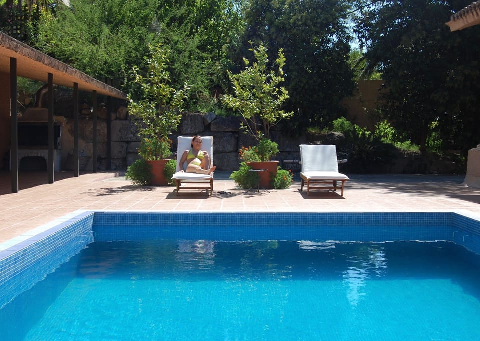 Private pool set amongst greenery and ancient stone walls
