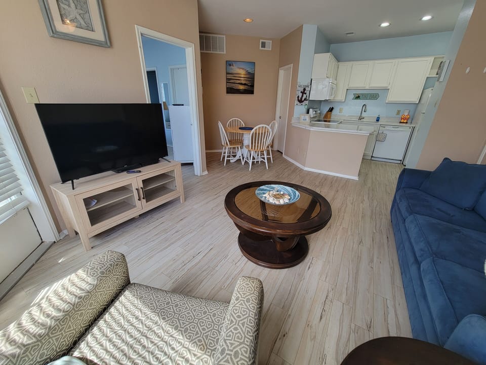 Living room, dining area and kitchen