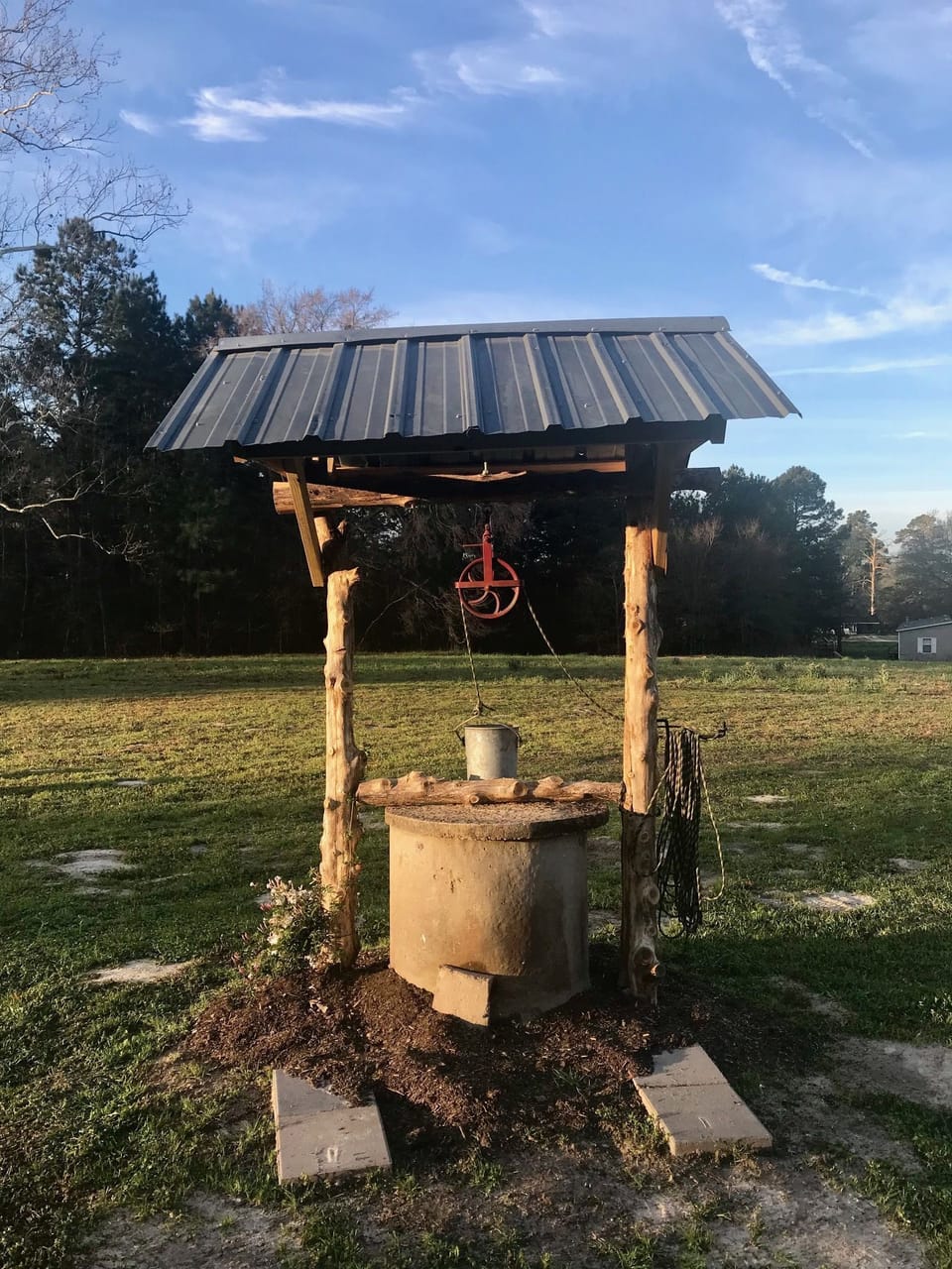 A secured old fashioned well is a perfect place to take photos.
