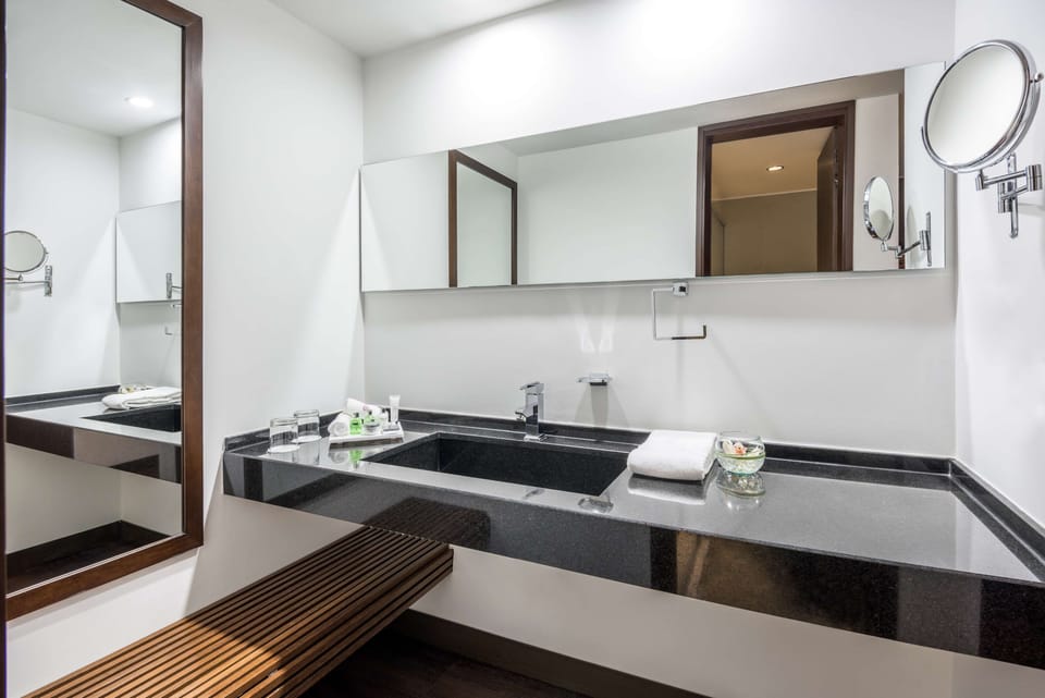 Shower, designer toiletries, hair dryer, towels