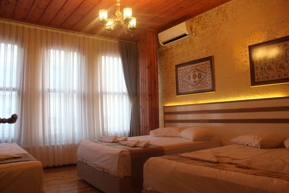 Family Room | Egyptian cotton sheets, minibar, in-room safe, blackout drapes