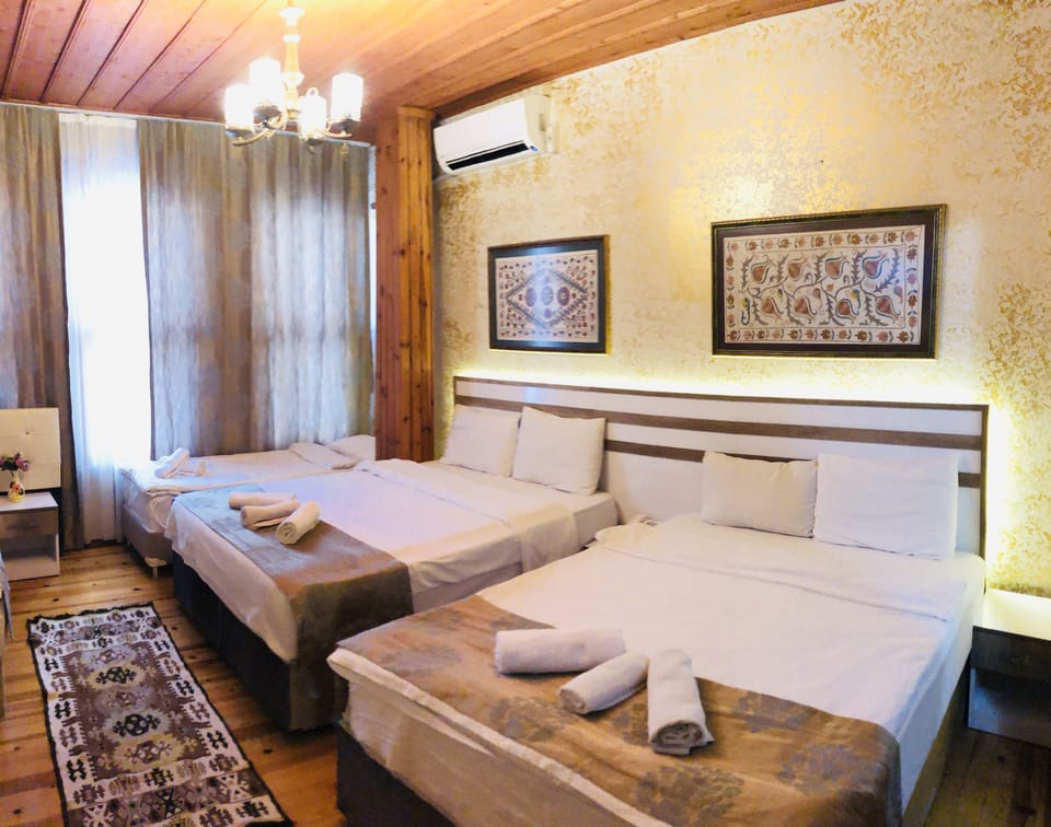 Family Room | Egyptian cotton sheets, minibar, in-room safe, blackout drapes