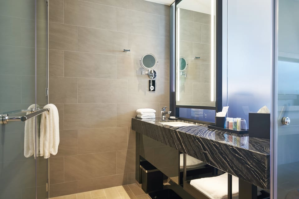 Designer toiletries, hair dryer, bathrobes, slippers