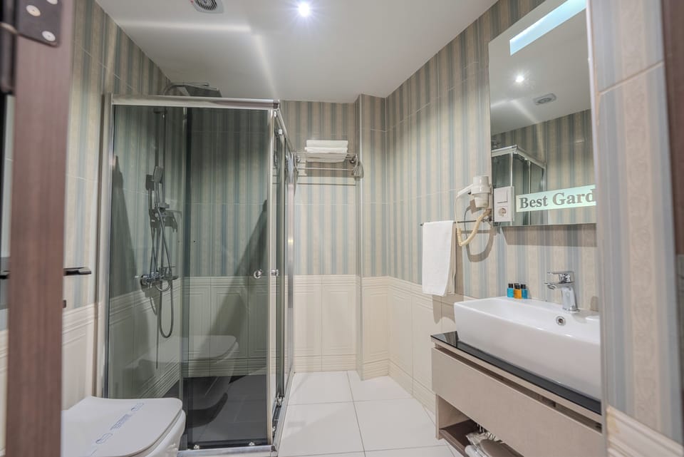 Shower, free toiletries, hair dryer, slippers