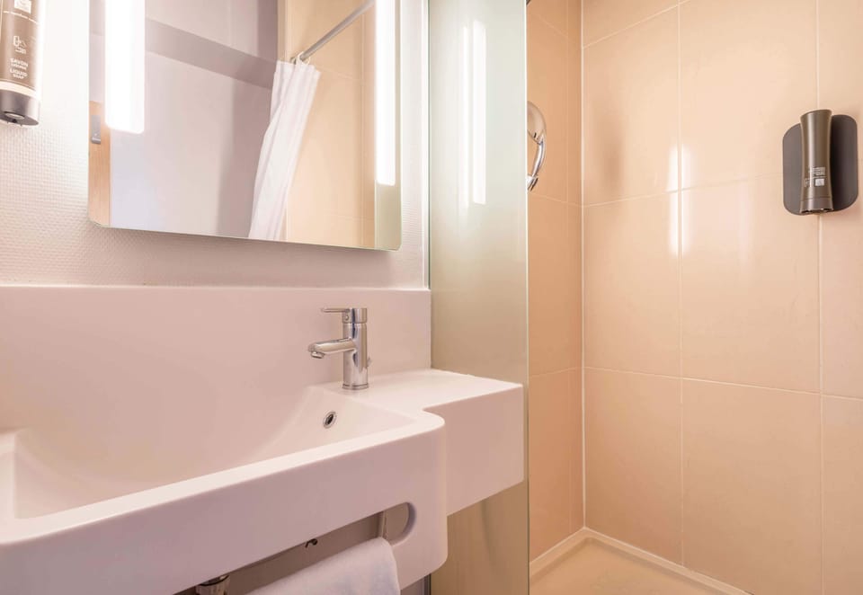 Shower, free toiletries, towels, soap