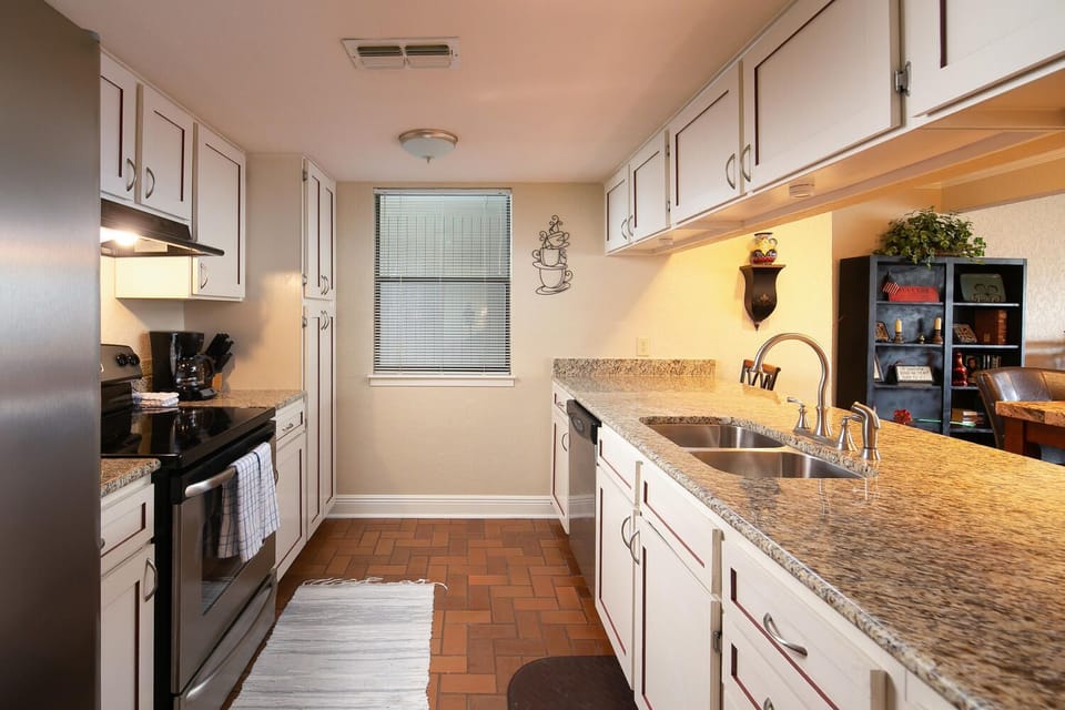Kitchen is fully stocked with plates, bowls, utensils, bake ware, glasses, pots and pans ETC...