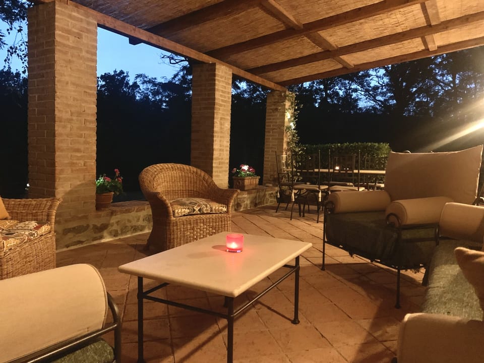 Relax on the private garden terrace featuring dining for eight