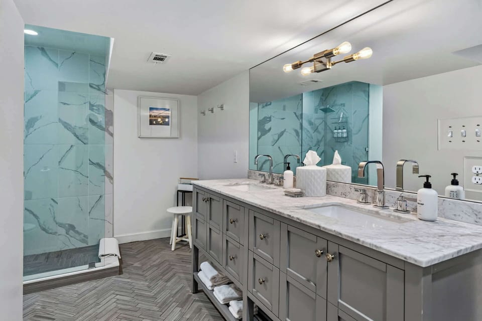 Bathroom 1: (complete with sink, shower, toilet, vanity mirror)