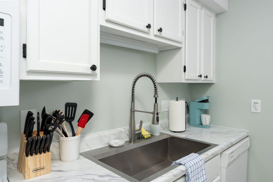 Your fully equipped kitchen features elegant marble countertops, modern fixtures, and everything you need to prepare favorite meals during your stay.