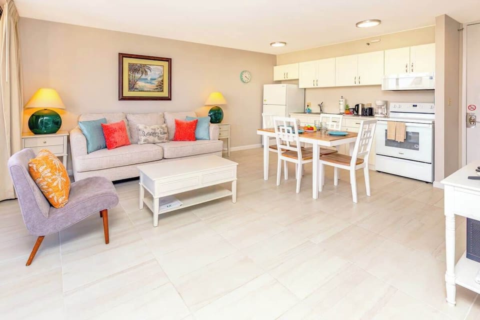 Bright open living area with a modern kitchen and comfortable seating.