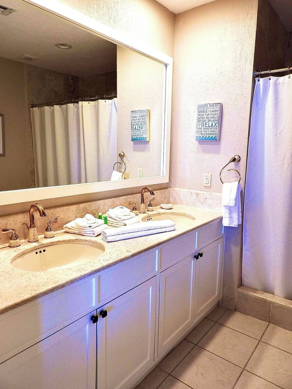 Master bathroom with a double sink and x-large shower. 
