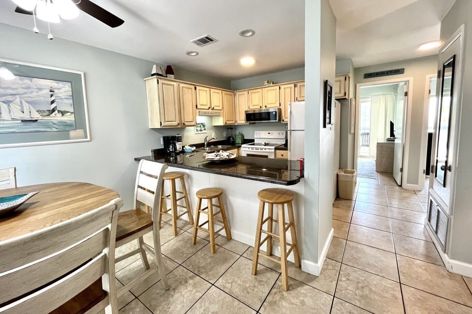 View of bar seating and kitchen at Ocean Reef 601.