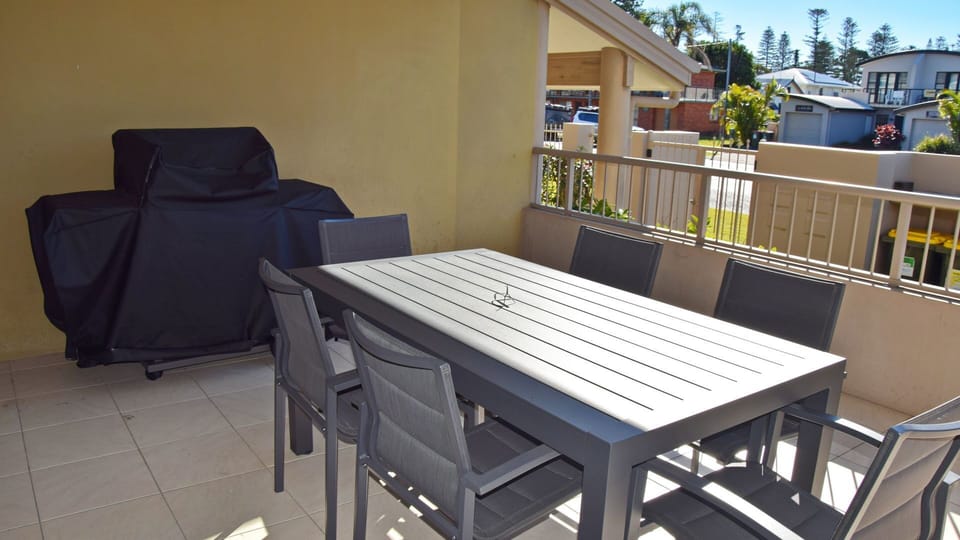 Outdoor dining and BBQ area.