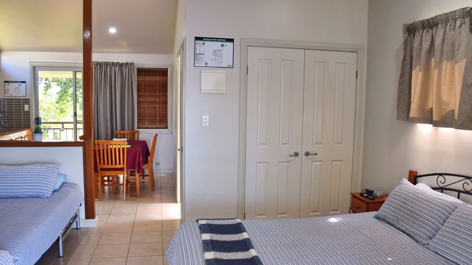 Bedroom with dining area in the back.