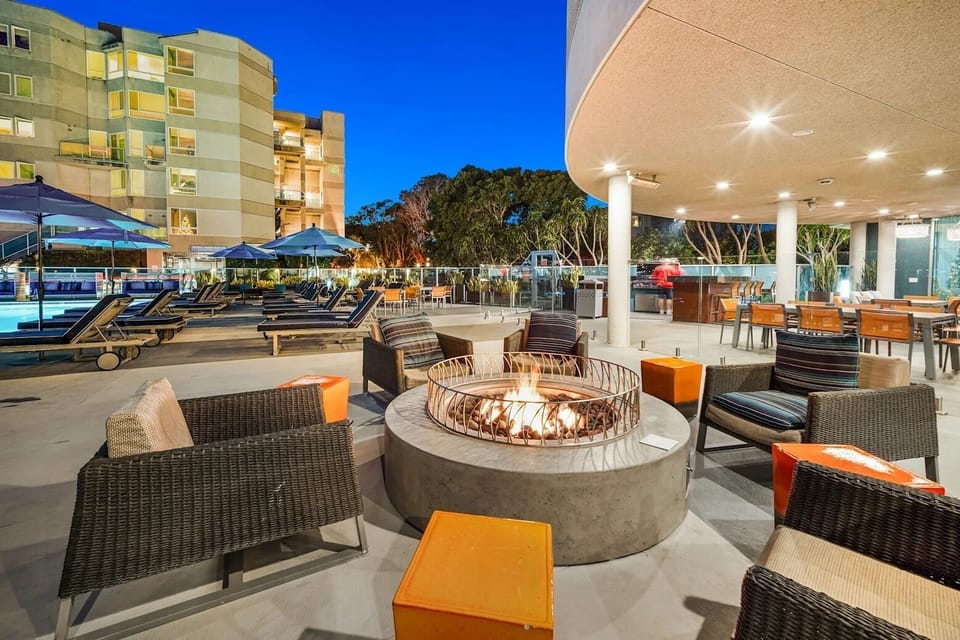 Multiple areas to grill and dine al fresco, embracing outdoor living.
