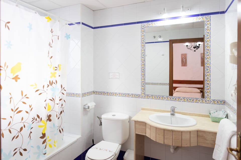 Double Room (Extra Bed) | Bathroom | Combined shower/tub, hair dryer, bidet, towels