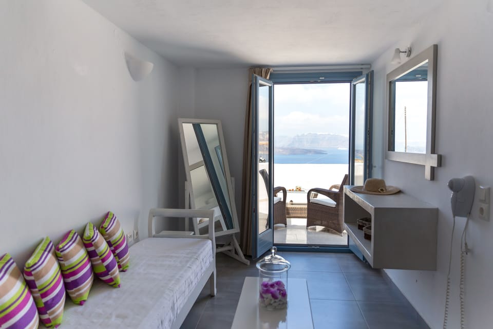 Junior Suite, Sea View | Living area | TV
