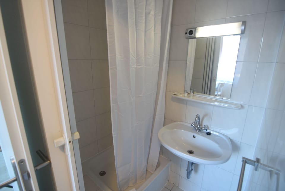 Shower, free toiletries, hair dryer, slippers