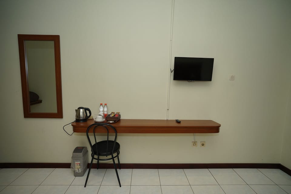 Standard Double Room | Desk, iron/ironing board, bed sheets