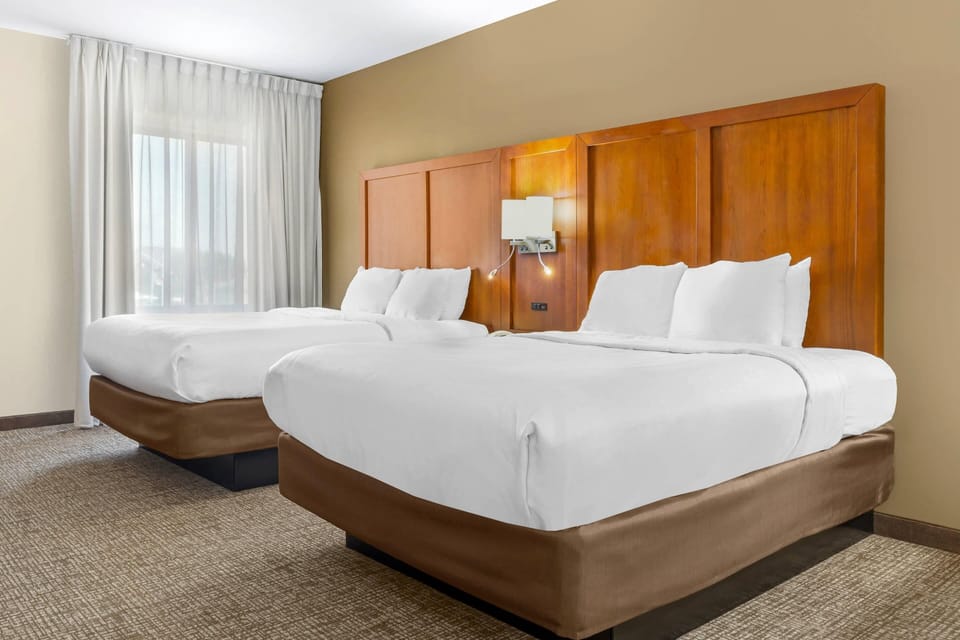2 Queen Beds, 1 Room Suite, 2-Person Sofabed - Pet Friendly | Desk, laptop workspace, blackout drapes, iron/ironing board