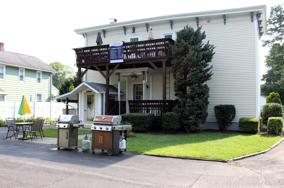 Backyard patio area, small covered deck and BBQ grill