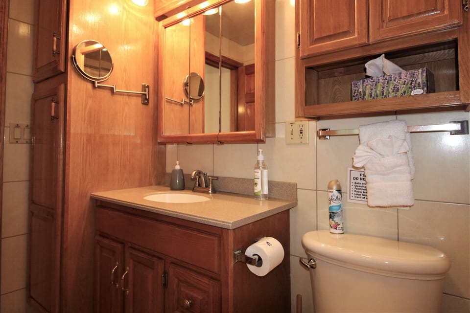 First floor fully tiled bath with plenty of storage space!