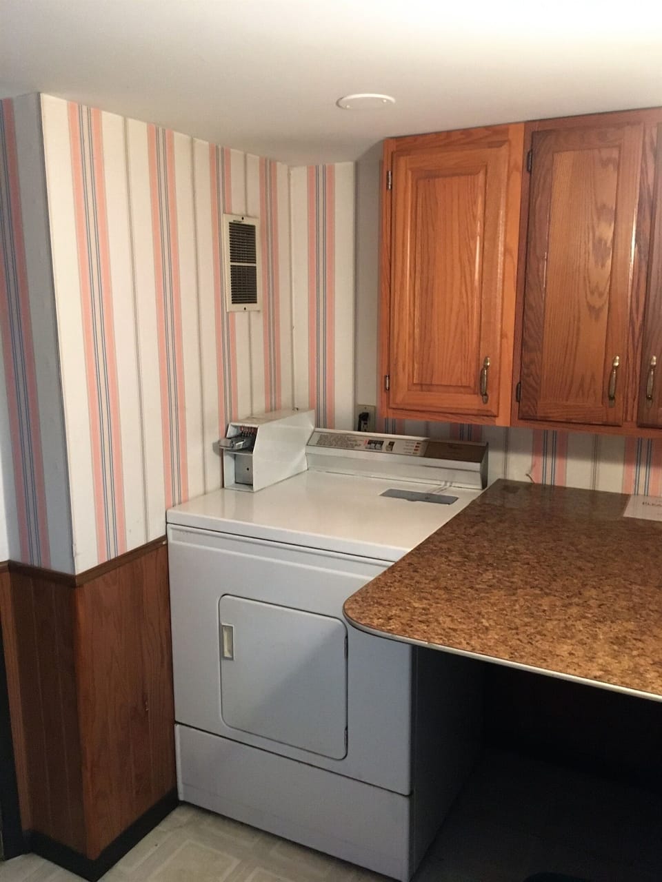 Dryer and laundry folding area - Laundry is FREE for our guests (yes, it's coin op, but we provide the quarters!)