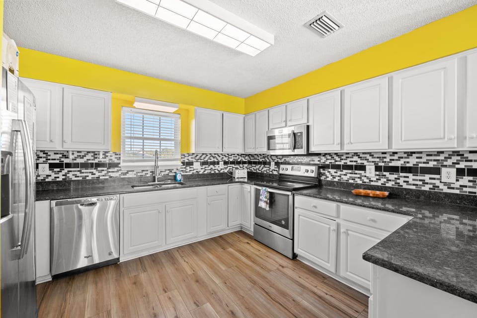 The chef will enjoy this fully-equipped kitchen with modern appliances.